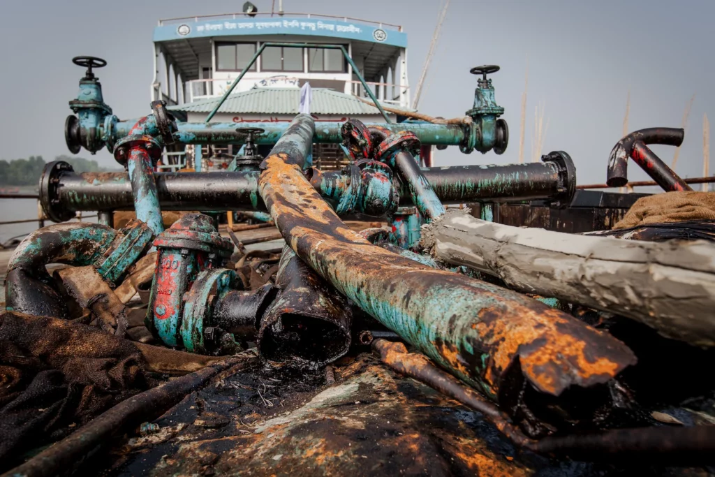 Ships spilled hundreds of tonnes of oil, coal and fertiliser into the world’s largest single patch of mangrove forest, while the industry routinely dump its wastewater into the ocean.